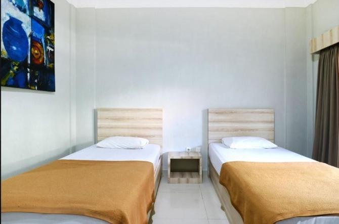 Palm Garden Kuta Hotel กูตา ภายนอก รูปภาพ
